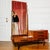 Mid-Century Entryway Vanity/Styling Table, circa 1960. An elegantly proportioned piece crafted from wood and teak veneer,...
