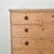 Dimensions: 20"D x 48.25"W x 43.75"H A warm honey toned antique pine chest of drawers, beautifully aged with the quiet...