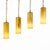 Set of four mid-century Murano tubular pendant lights in richly layered amber and white “incamiciato” glass, inspired by...