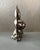 Charming vintage two-piece metal confectionery mold featuring a dimensional seated rabbit with long upright ears,...