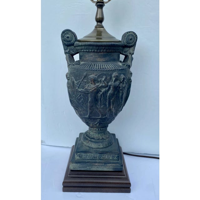 Plaster handled urn table lamp mounted on sqaure plinth wood base. Model of the Townley vase cast in relief.