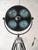 A 1960s hanau surgical lamp with four blue glass lenses, reworked into a floor lamp and mounted on a wild heerbrugg wooden...