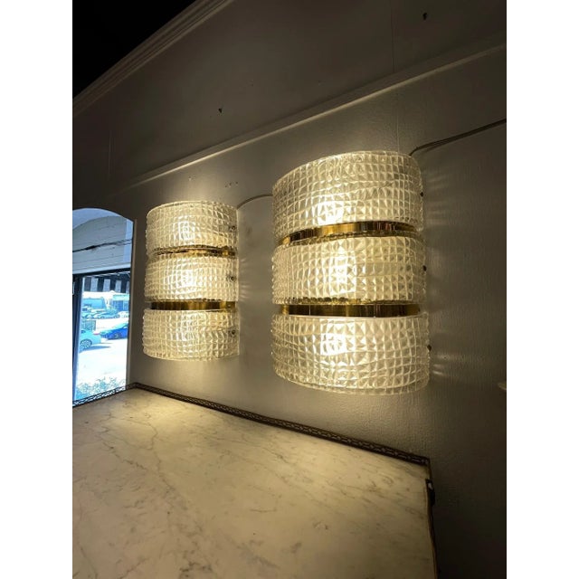 Elegant large scale pair of Murano glass and brass barber style sconces. These create a lovely textural look. Very nice!