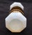 Octagon shaped iridescent milk glass door knobs with a wide brass shank and rosettes. Good condition with appropriate wear...