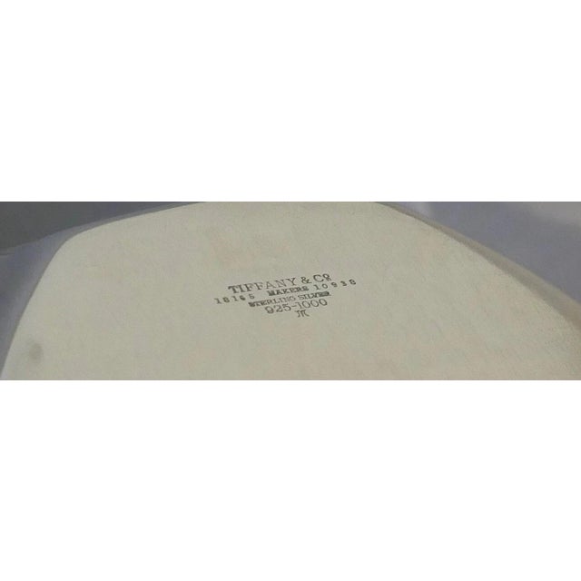 This stunning vintage mid 20th century sterling silver fruit bowl is beautifully designed by Tiffany & Co. The bowl has a...