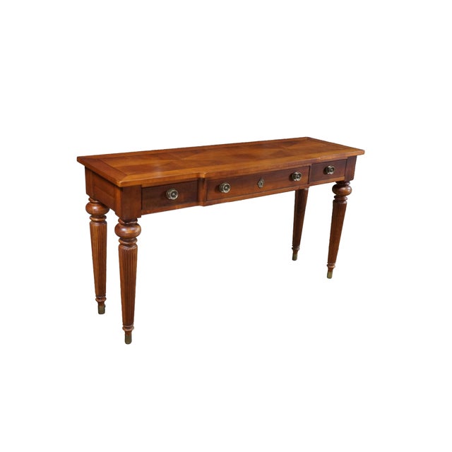 A classic Lexington Furniture console table crafted from solid cherry wood with rich, warm reddish-brown tones and elegant...