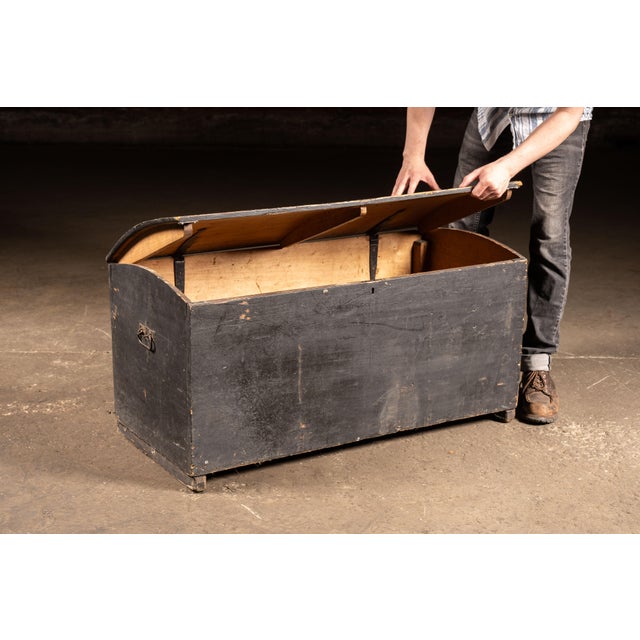 Painted wooden immigrant or steamer trunk with arched lid retaining hand-lettered identification reading "JULES D'HOOGE"...