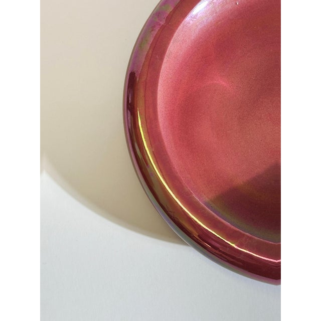 This shallow porcelain lustre bowl by Devon Lustre Fieldings was produced in Staffordshire, England, around the 1930s, and...