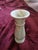 This neoclassical marble vase consists of various shades of cream throughout the piece. The vase is substantial in weight...