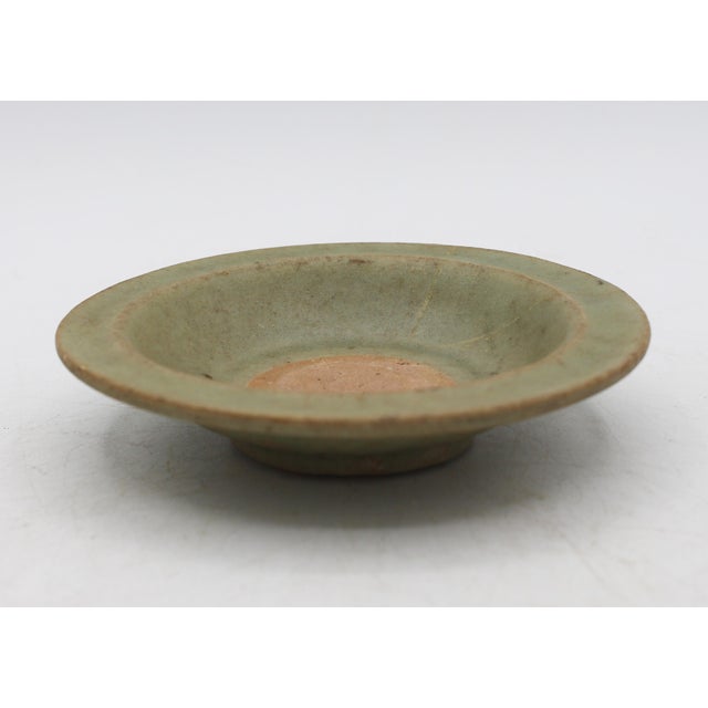 Chinese Yuan Dynasty celadon glazed pottery libation dish, circa 1271-1368. Red pottery. Longquan Region (SW China). Old...