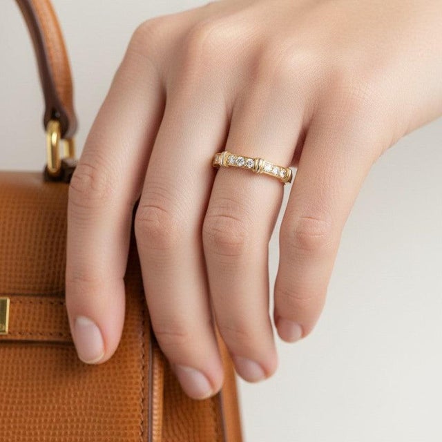 Cartier Contessa ring. Crafted in 18k solid gold, this contemporary masterpiece features a stunning alignment of 9...