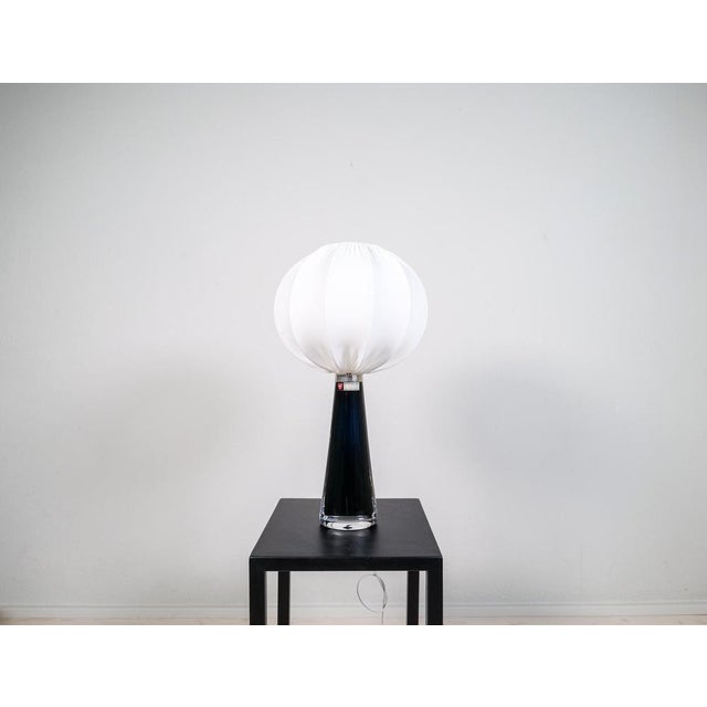 Table lamp in crystal, model rd1566 by carl fagerlund for orrefors, sweden. The lamps have a stunning black color with...