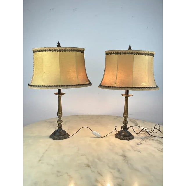 Pair of table/bedside table lamps in bronze, Italy, 1940s The lights are in good condition, the lampshades should be...