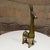For your consideration, a vintage brass figurine of a stylized animal, often identified as a llama, burro, or donkey,...