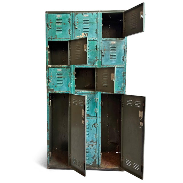 Vintage industrial iron locker cabinet. Original rich deep sea teal color with characteristic signs of age and use....