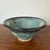 Studio pottery bowl by Mark Einhorn in a beautiful blue-gray-green glaze. Signed "EINHORN". Diameter: 7" edge to edge...