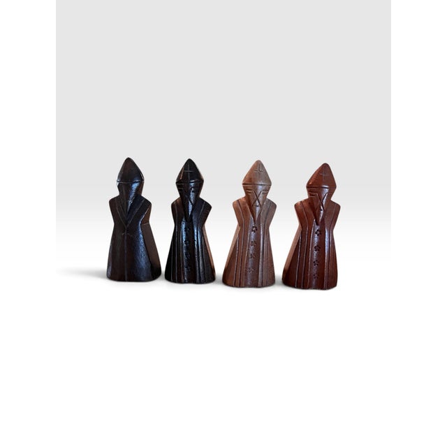 Striking vintage hand-carved figural chess set attributed to the Makonde carving tradition of East Africa, most likely...
