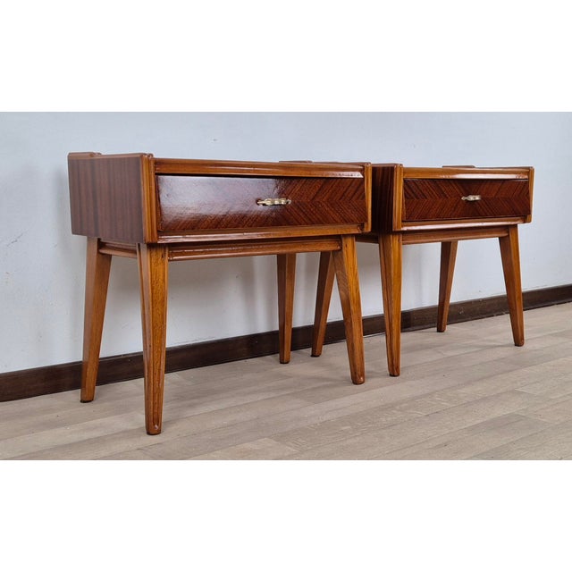 An extraordinary pair of minimalist Art Deco nightstands in herringbone walnut, walnut quill, and maple. Furrowed edges...