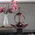 This stature is fashioned from wood into an abstract figure sitting in a yoga pose. It is then finished in a glossy pewter...