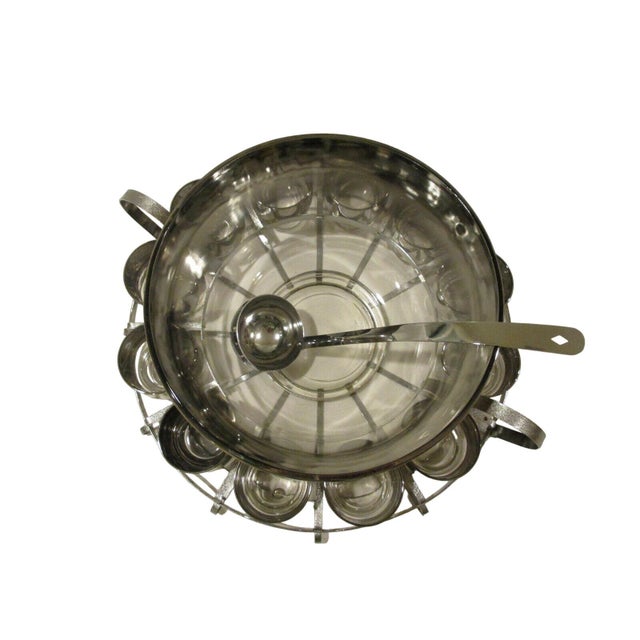This Mid Century Silver Fade Punch Bowl Set by Dorothy Thorpe features a vintage retro design. The 15-piece set is a...