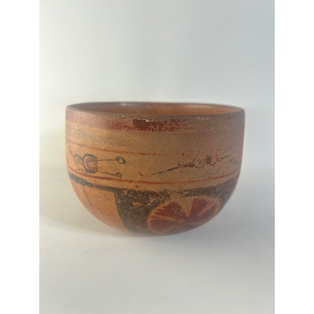 Mayan Polychrome Bowl With Flora and Fauna Motif, 600-900 C.E. Offered is a beautiful Mayan bowl, with a concave base and...