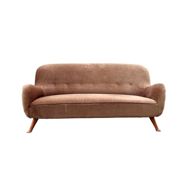 This elegant sofa by Berga Möbler is a remarkable example of Danish craftsmanship from the 1940s. with its curved...