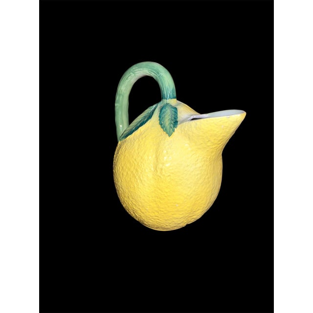 Late 20th Century Italian Lemon majolica pitcher. Vibrant hand painted glazed yellow with raised and Hand-painted leaves....
