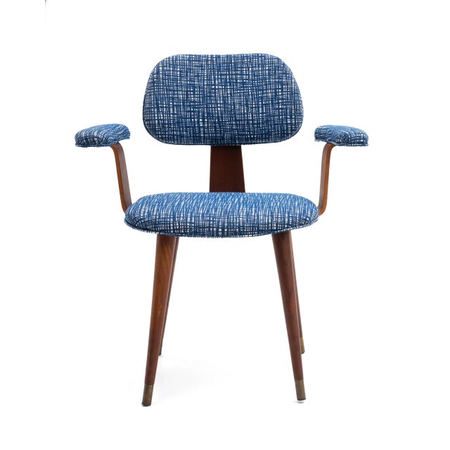 A walnut bent plywood armchair after the designs of Thonet and Charles & Ray Eames. Freshly upholstered in a bold blue and...