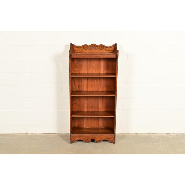 A gorgeous antique Victorian or Arts & Crafts carved oak bookcase USA, Circa 1900 Measures: 27"W x 12.5"D x 58"H. Good...