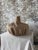 A striking oversized woven vessel with bold sculptural form and rich organic texture. Crafted in natural fibers, this...