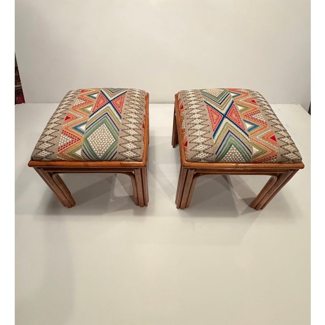 Stylish pair of vintage rattan based benches with stunning geometric upholstery. Details Dimensions Height: 19 in (48.26...