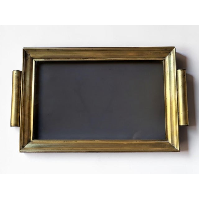 Hollywood Regency brass tray, 1960s / Smoked glass Probably Italian made. The finish is impeccable (welds, screws, etc.)....