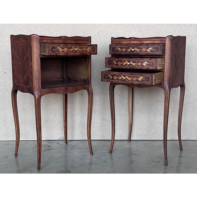 A pretty pair of French, inlaid kingwood, one drawer nightstands with tray accents, circa 1930. Pair of French Louis XV...
