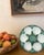 Classic French green and white majolica oyster plate with white shell design wells for oysters and a center well for...