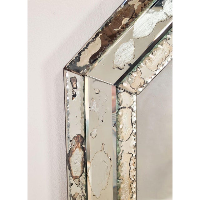A classical octagonal Venetian mirror, Italy circa 1920. The central plate is surrounded by three pieces of mirror; the...