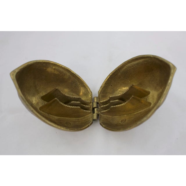 Mid-century solid brass walnut nutcracker. No maker's mark. Minimal age wear.