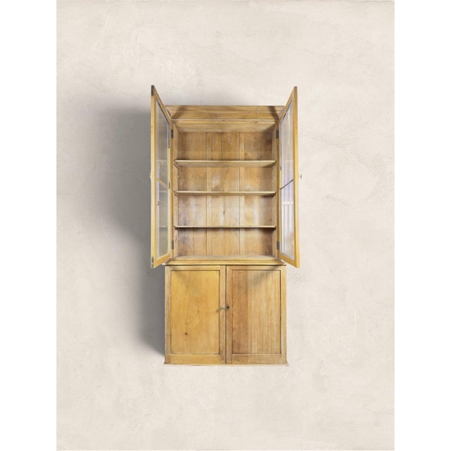 A beautiful antique English pine display cupboard or hutch, dating to circa 1880. Tall and wonderfully narrow, this late...