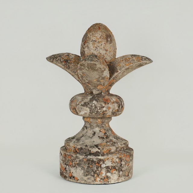 Lofty 19th century Fleur de Lis long a symbol of French royalty, hand carved in stone, having a classical base, as a...