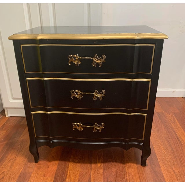 Chest Console Nightstand by Permacraft. A wonderful Black lacquer with gold trim Chest with detailed brass decorative...