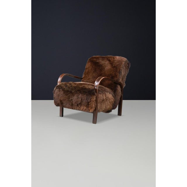Mid-Century Modern Czech Bentwood Lounge Chair by Kozelka & Kropacek in Texel Sheepskin, 1940s (12 +Available) A rare...