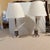 Pair of Vintage Ralph Lauren Tall Column Lamps Pair of tall Tuscan column-form lamps crafted in silvered solid brass with...