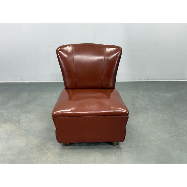 Original Mid Century lounge chair produced in Italy in the 1950s. The chair showcases refined Italian modernist...