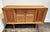 Mid-Century Danish oak wood sideboard circa 1960s, designed and manufactured by Henning Kjaernulf. Sculptural, carved wood...