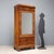 Umbertino wardrobe veneered in walnut. Front door with mercury mirror and two drawers, 45° uprights and legs, the former...