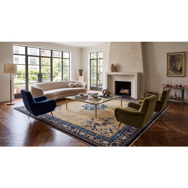 This exquisite late 19th-to-early 20th century antique Chinese wool rug features an intricate, golden-ochre geometric...