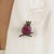 The 10 Ct Ruby & Diamond Wise Owl Brooch Pendant is crafted in 925 sterling silver with an oxidized finish that enhances...