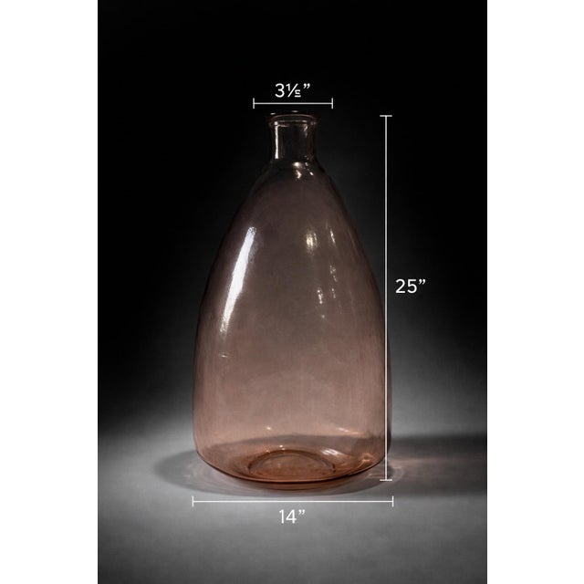 Mobile-Ready Description Oversized blush pink glass demijohn vase standing 25 inches tall. The sculptural bottle form...