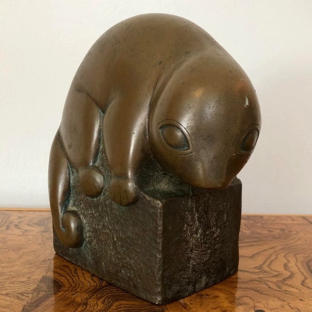 Mid-century bronze over plaster figure of a baby opossum. Signed by Marian Weisberg on bass. Minor wear consistent with age.