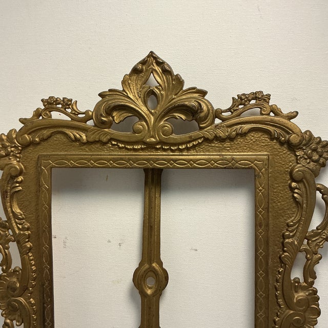 Beautiful frame that has some patina. No glass and missing fasteners. The stand has one side holding the top broken but it...
