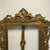 Beautiful frame that has some patina. No glass and missing fasteners. The stand has one side holding the top broken but it...